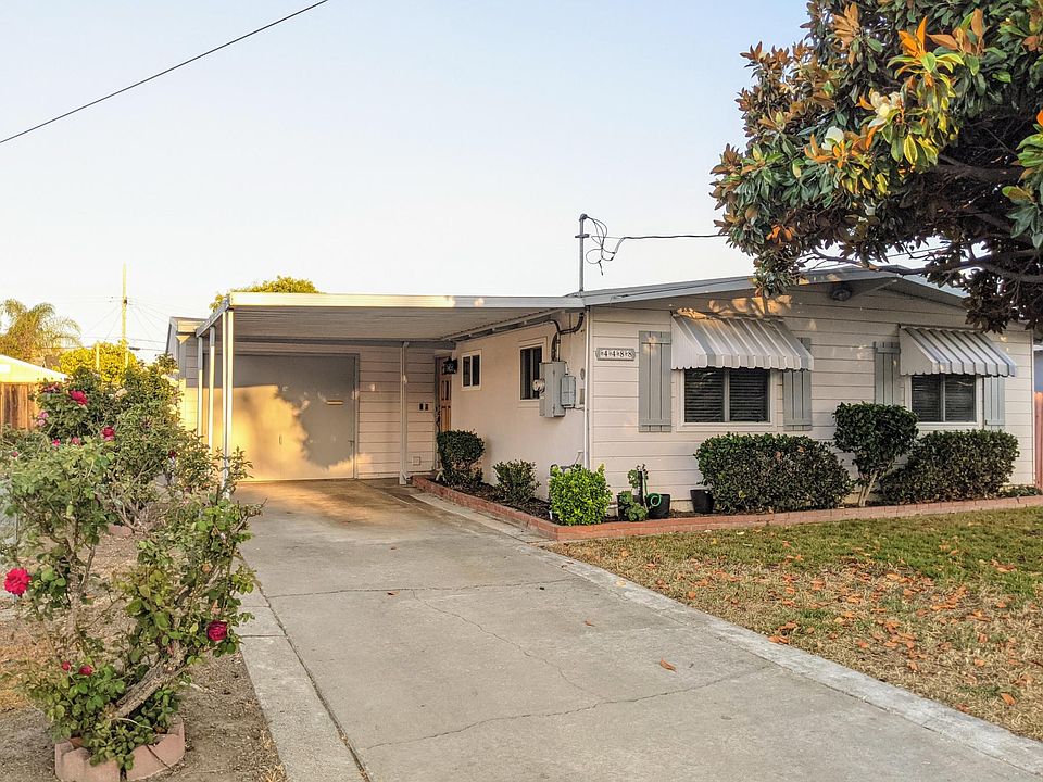 Front View of the House. Covered Carport for Shaded Parking.