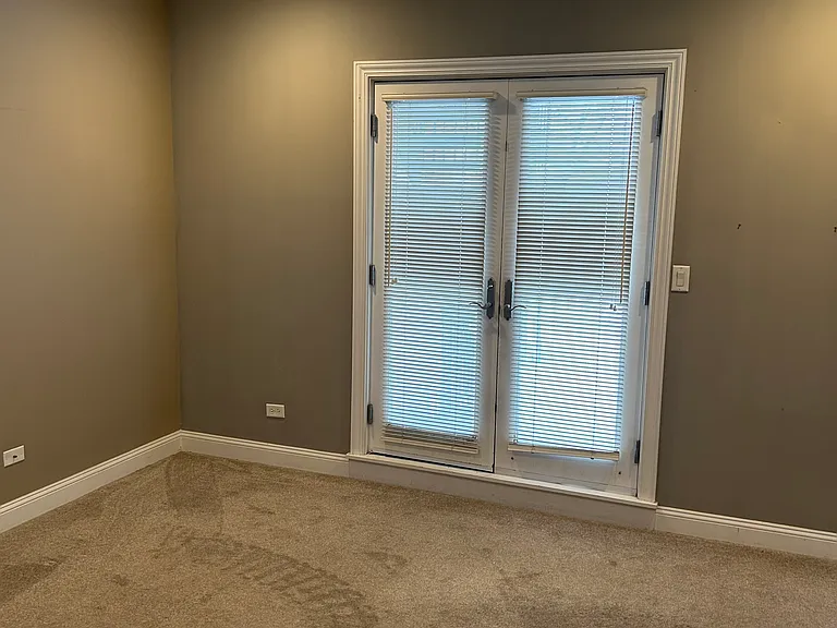 Primary Bedroom and balcony French doors