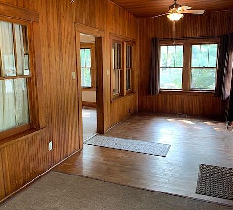 4 season front porch with hardwood floors. Versatile space that is great for a home office or your choice!