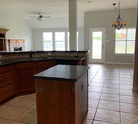 Kitchen, 2nd Dining Area and Large Living Room are great for open play and hosting. Windows across the back of the house (South Side) open to back yard.