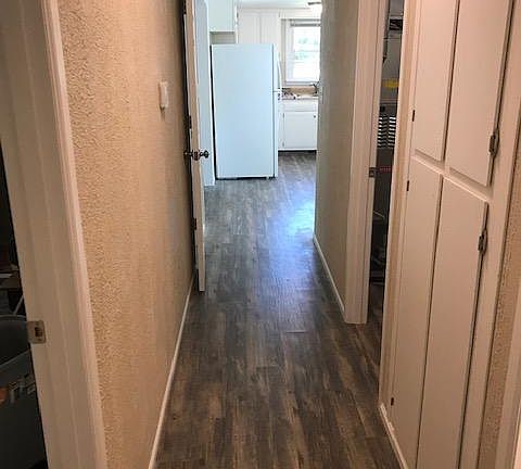 Hallway with additional closet and storage area