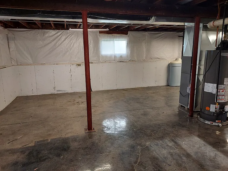 Basement partial view from doorway - colored epoxied floor - all clean and dry !
