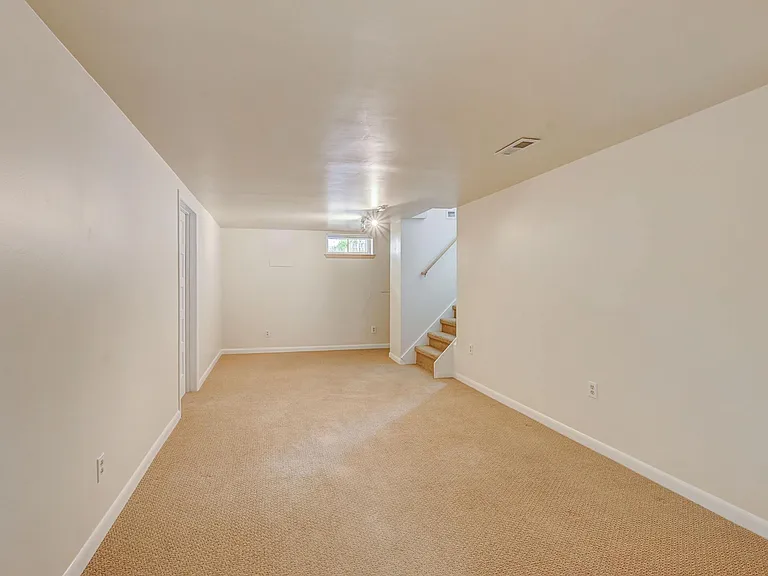 Downstairs living area and stairs to upstairs
