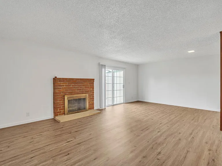 Dining/Living Room with fireplace.
