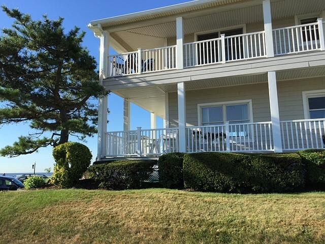 Outside side property view with wrap around deck.