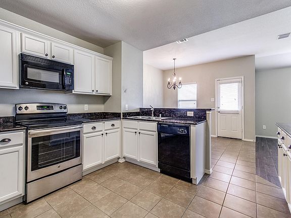 Large kitchen with walk in pantry and lots of cabinet storage. Nicely open to living area. SS dishwasher to be installed