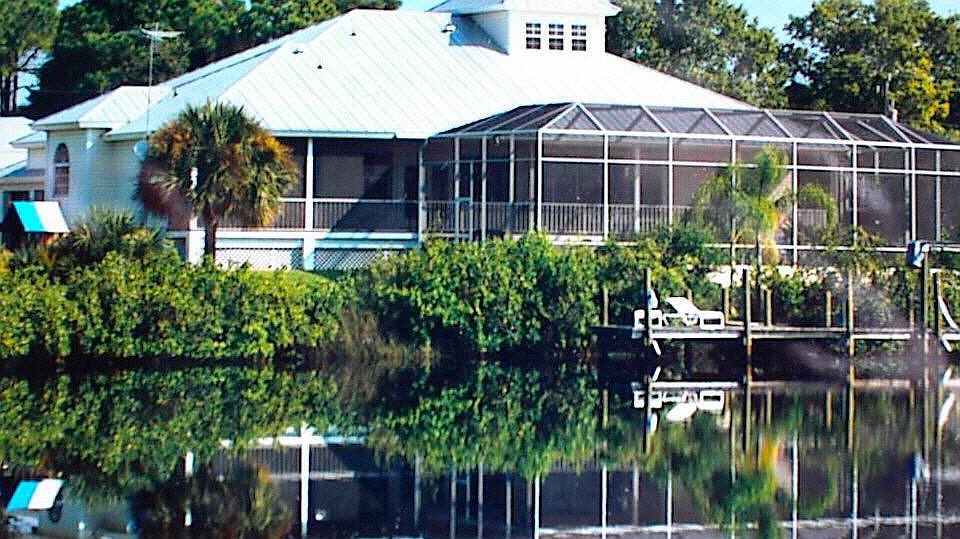 220 feet of waterfront. 
Dock. 
Gulf access