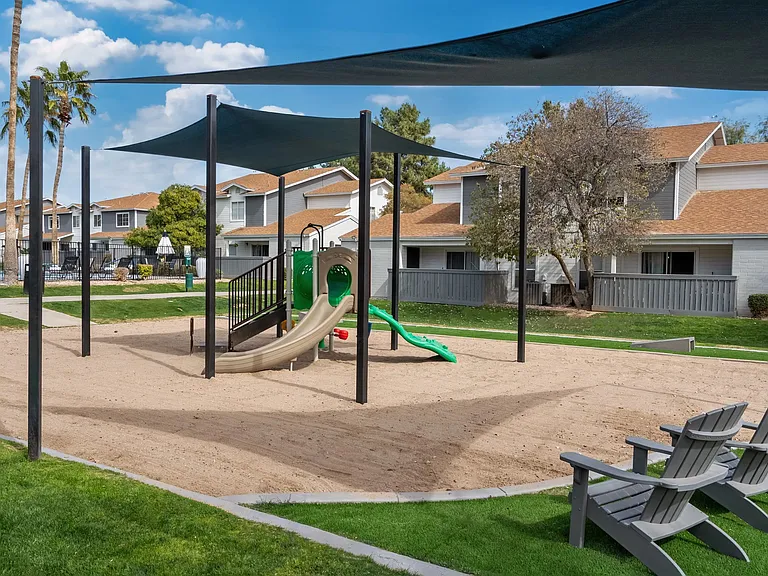 Immerse your family in joy at our vibrant Tot Lot. A sandy play haven, shaded by sail shades, with cozy seating for parents to relax and relish the play.