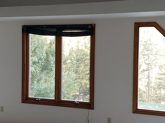 Amazing views from every large window! Vaulted ceiling with ceiling fan.