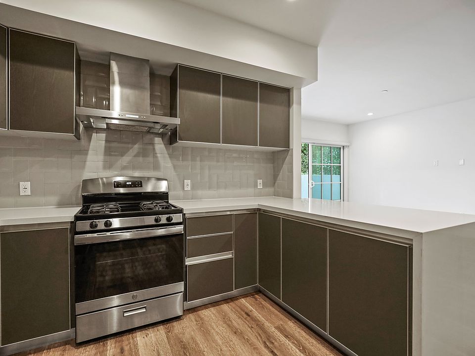 Kitchen with Stainless-Steel Stove and Microwave Oven