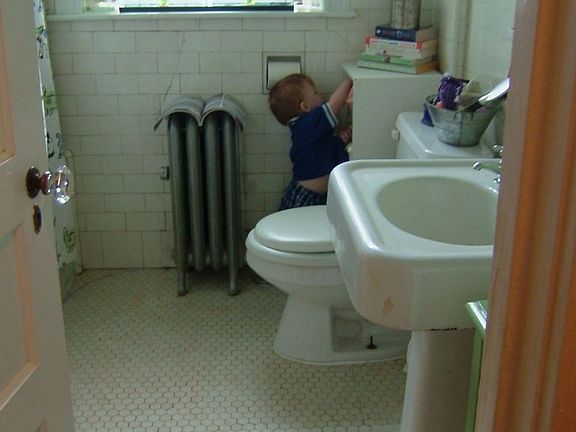 Bathroom has original subway tiles & sink