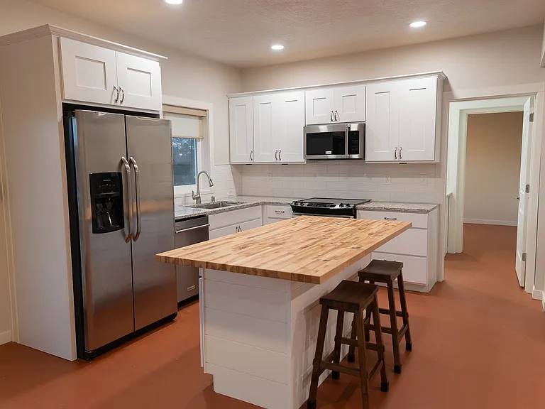 Basement ADU - full kithen includes electric stove, fridge/freezer, microwave/vent, dishwasher. All brand-new Huntwood Cabinets with built-in features.