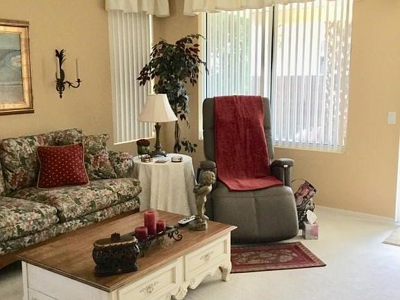 Living area with sliders to backyard