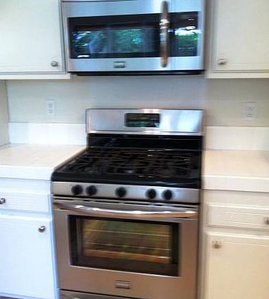NEW STAINLESS STEEL STOVE