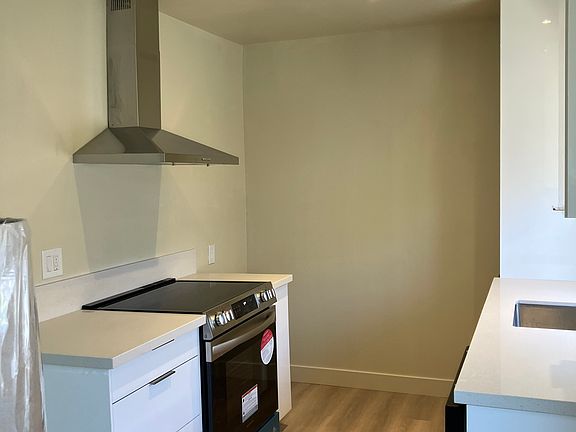 New kitchen featuring new stainless steel range. Base cabinets with deep drawers and spice pullout.