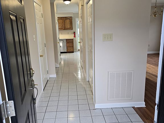 Foyer with ceramic tile into kitchen