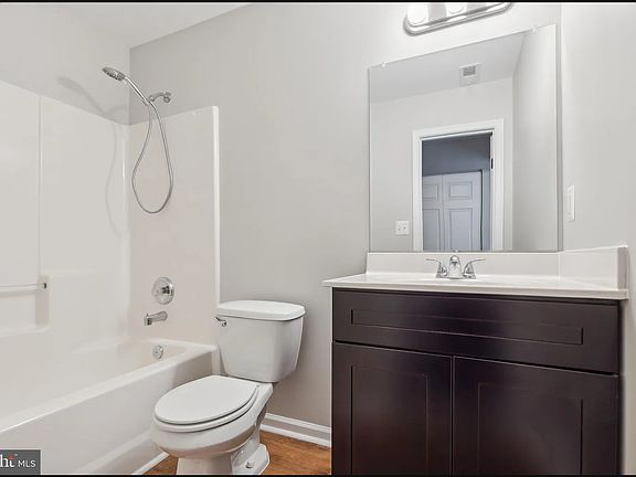 Bathroom directly to the right of Bedroom