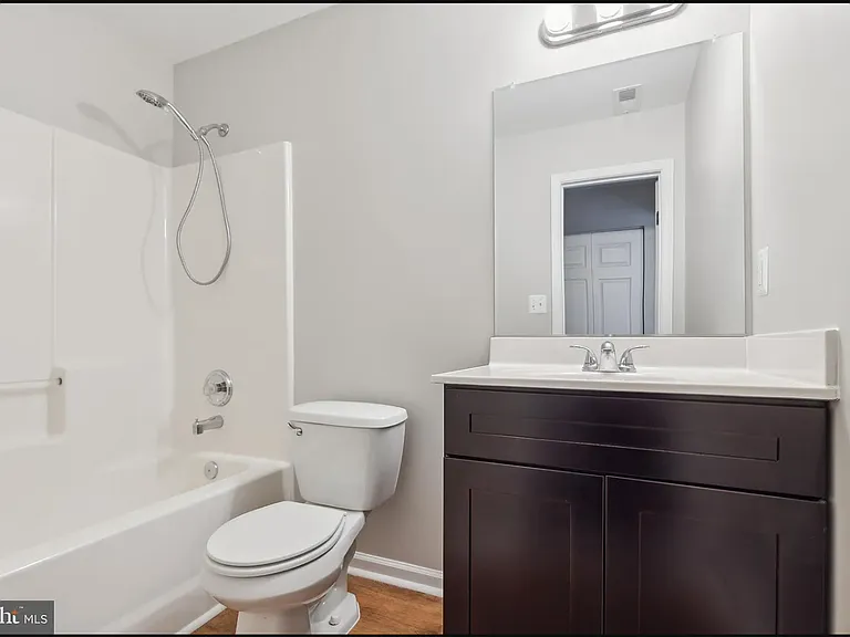 Bathroom directly to the right of Bedroom