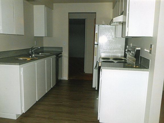 looking into kitchen and hall to the two bedrooms and bath