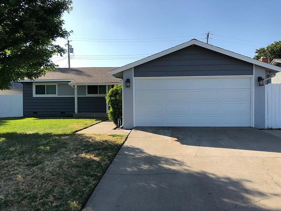 Large front yard. Updated exterior lighting, garage door, and paint!