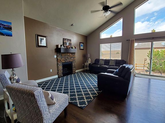 Bright, open living room with cathedral ceilings.