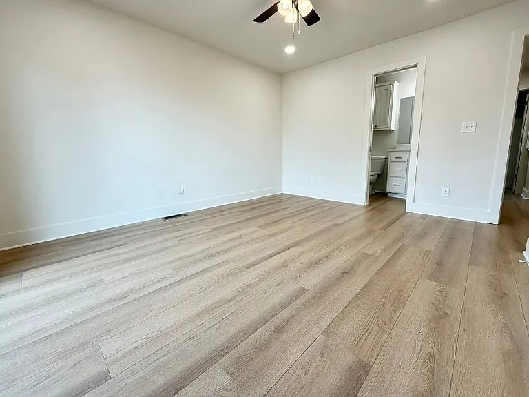 View across master bedroom from coffee patio door