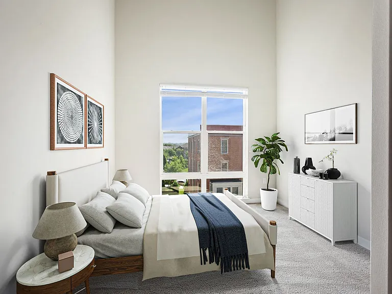 Retreat to your spacious, bright bedroom with lofty ceilings.