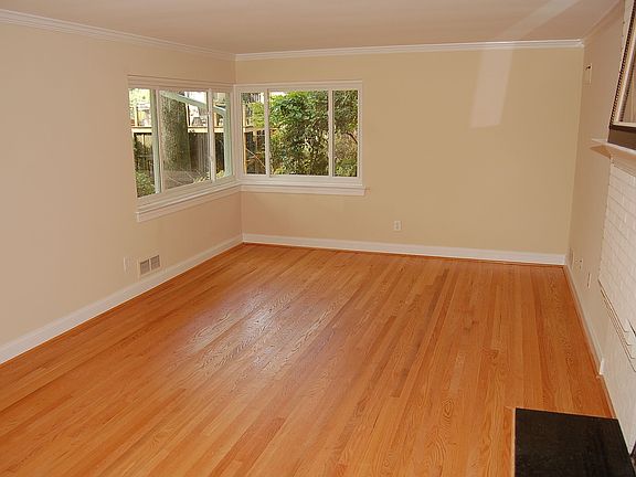 Living Room w/ Wood Burning Fireplace