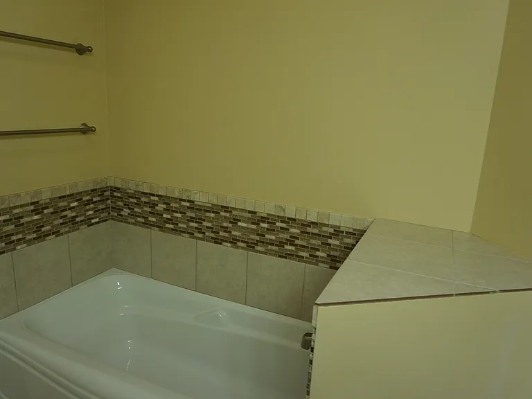 master bathroom with shower stall and extra large tub.