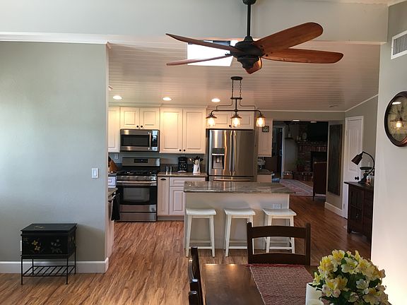 New hardwood floor, ceiling skylights, custom baseboards, an