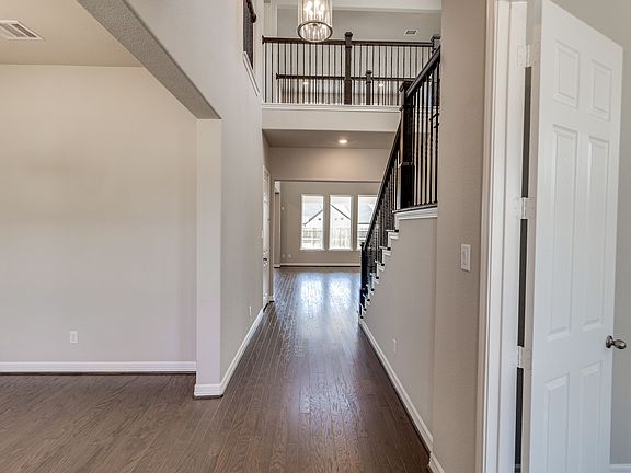 Foyer open to study, formal dining room and leads to living area