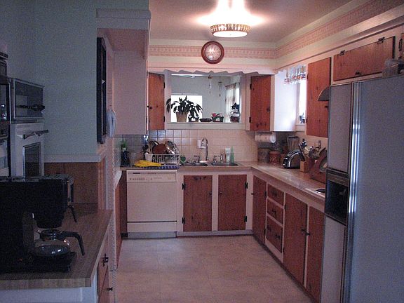 Kitchen taken from nook.  Note elevated built-in oven and microwave on left.
