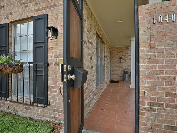 A peek at the covered front porch and private entry. Get ready, you are about to be "WOW'd"