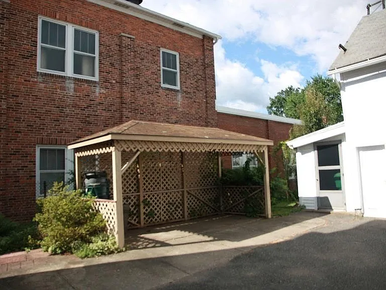Back yard gazebo near garage