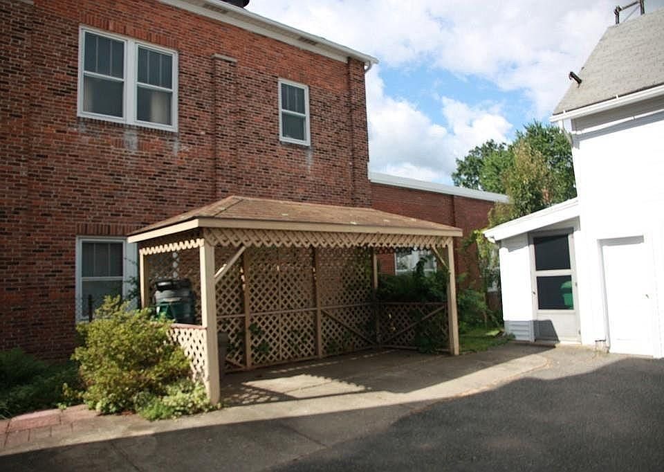 Back yard gazebo near garage