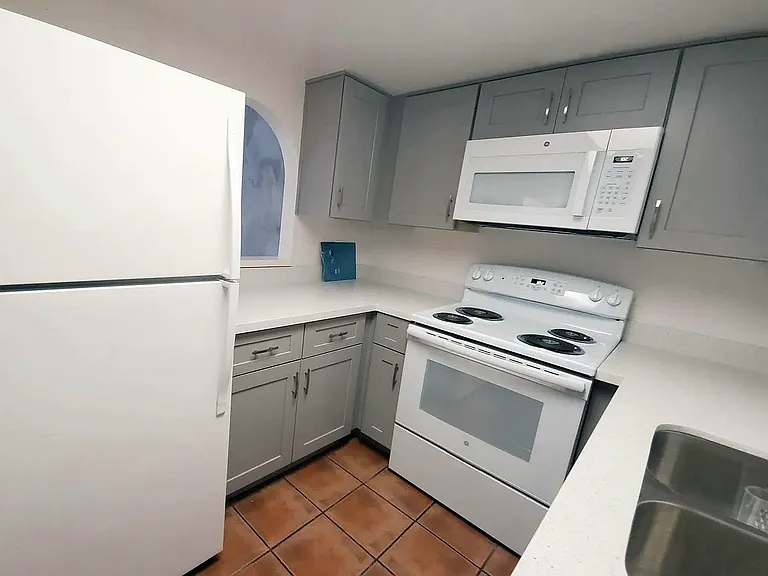 Updated kitchen with soft close cabinets, newer appliances, and quartz countertop.
