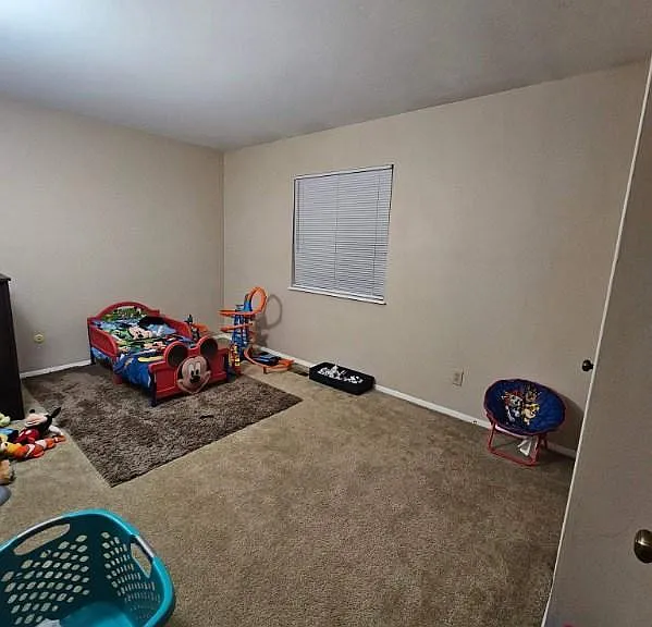 2nd bedroom upstairs which includes a walk in closet