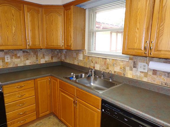 Kitchen with new stone backsplash