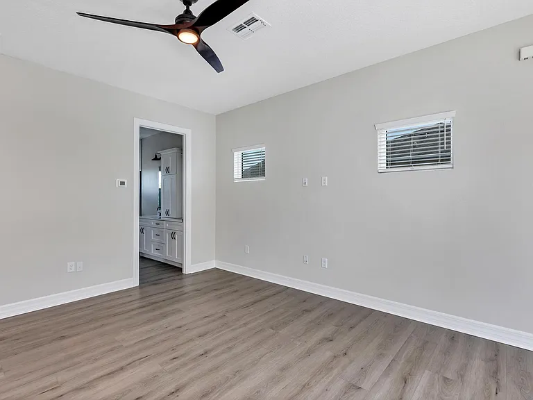 View of great room / living room space facing south east towards bathroom.