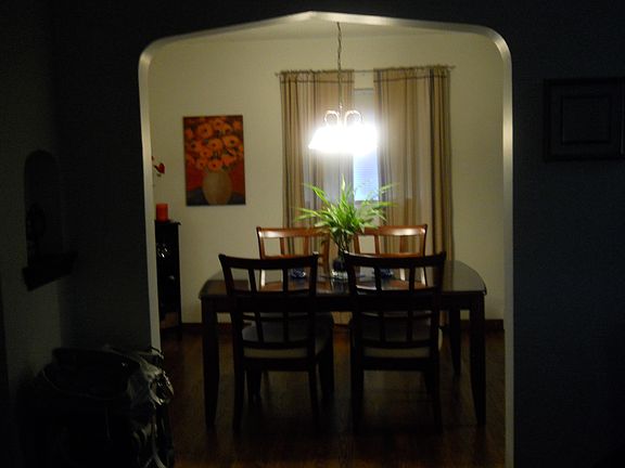 classic entry to spacious hard wood floors in dining room