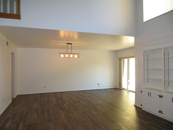 The dining area expands from the living room and has sliders going out into your second private courtyard