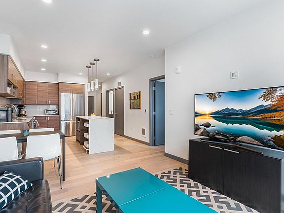 Light-filled living room with TV