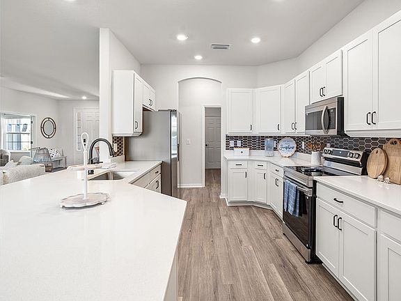 Enjoy an open kitchen with a counter-height breakfast bar - Westin II by Highland Homes