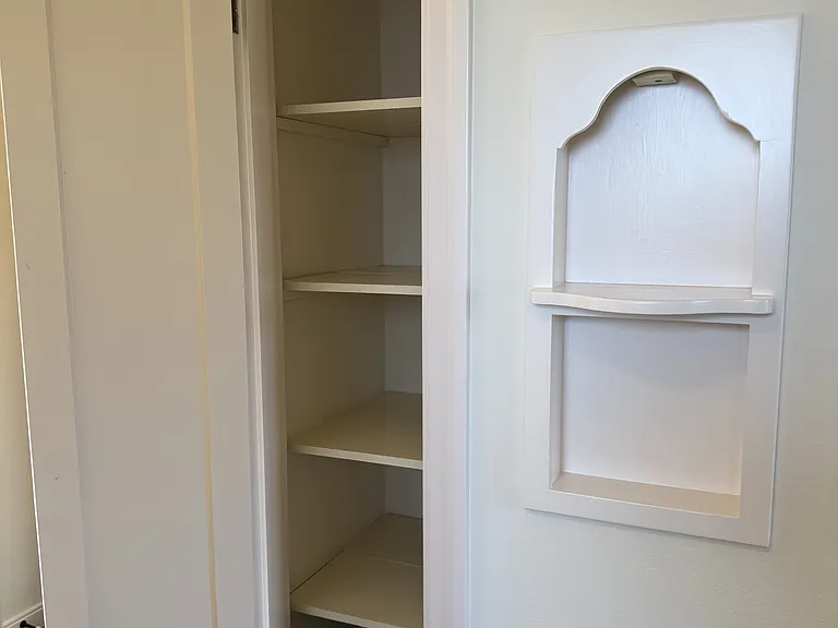 hall closet interior and phone nook
