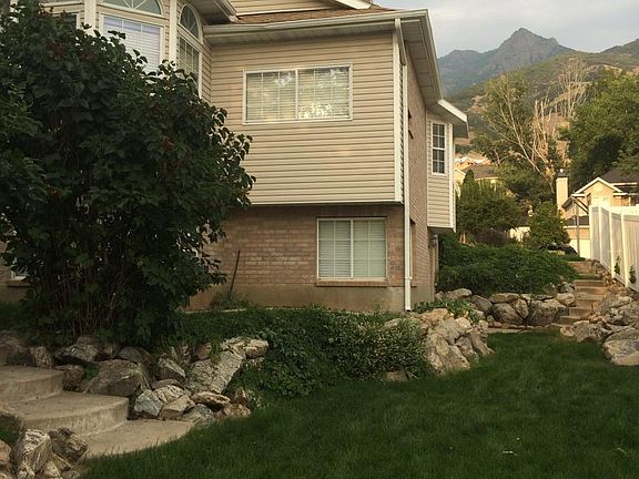 South side of house with terraced flower beds