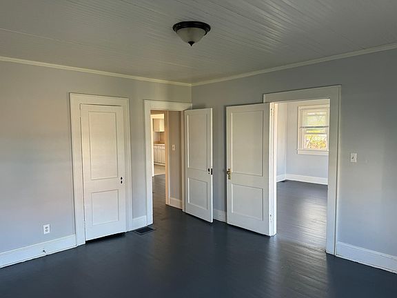 Bedroom #1, has door into living room and door into hallway leading to bathroom.