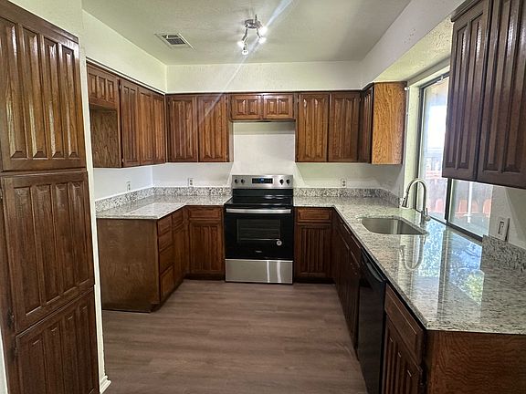 Full view of kitchen, new glass top stove.