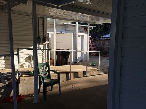 Storm cellar behind walkway