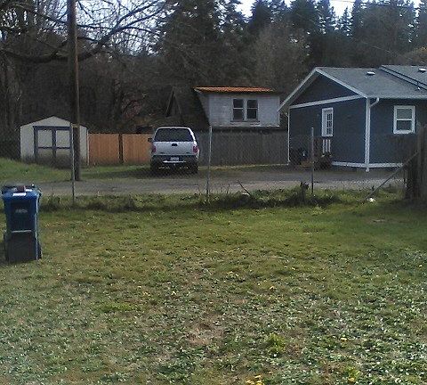 Back yard area leads out to alley. Off street parking a possibility here