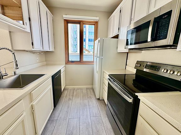Kitchen with Dishwasher and Electric Stove